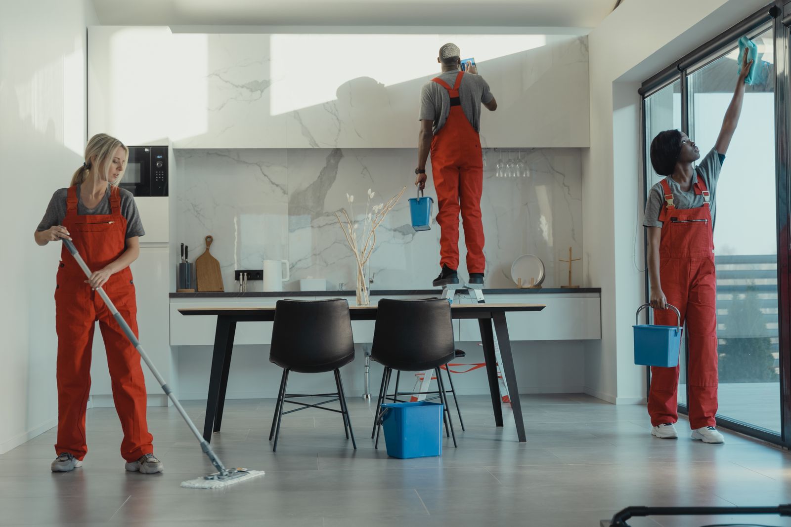 Professional cleaning team caring for a large contemporary interior
